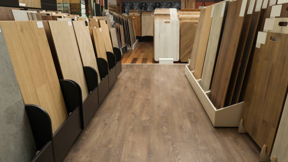 Winnipeg flooring store showroom with racks of laminate, vinyl plank and hardwood-look flooring samples in light oak to dark walnut tones.